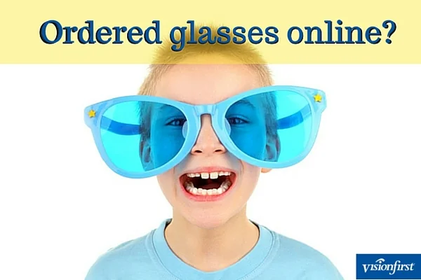 Little kid wearing oversized novelty glasses