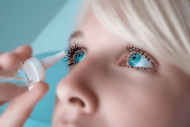 Woman using eye drops