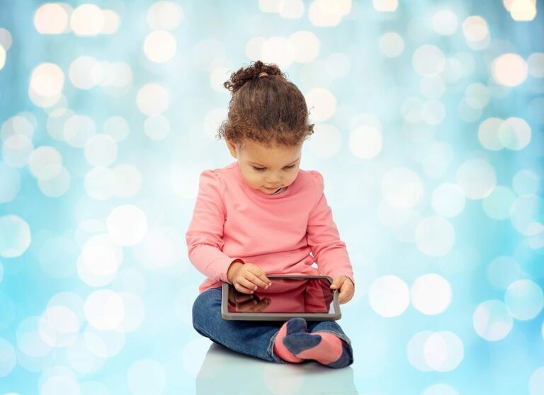 Little girl with a tablet