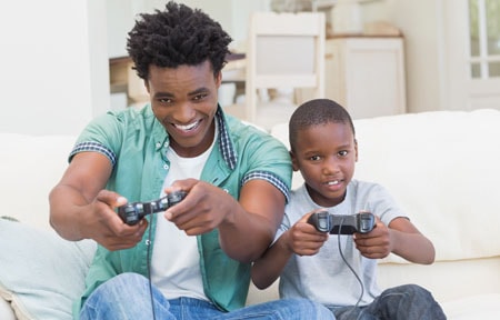 Man and child playing a video game