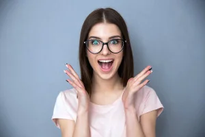 Excited woman wearing glasses